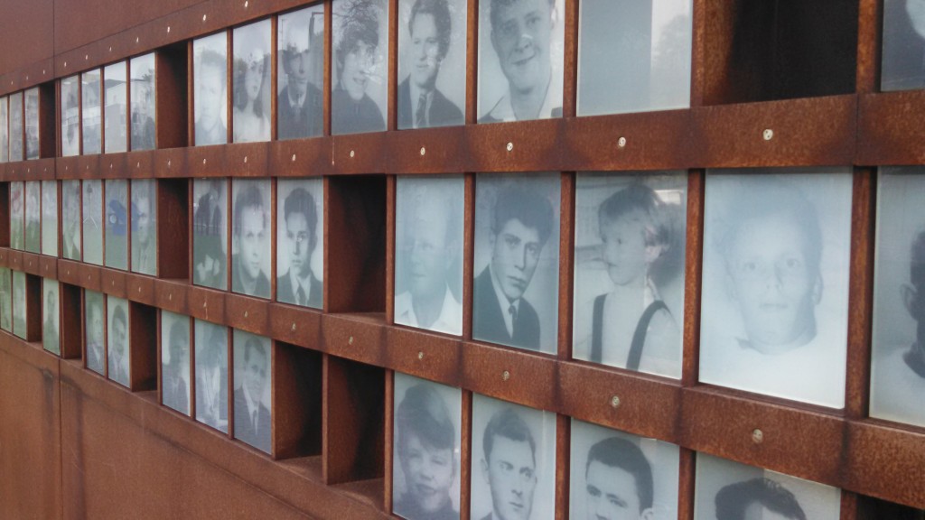 Window of Commemoration with pictures of some of the 138 people killed at the Wall.